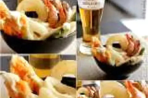 Gamberi e verdure croccanti, immersi in una leggera pastella per fritti, accompagnati da una birra bionda.