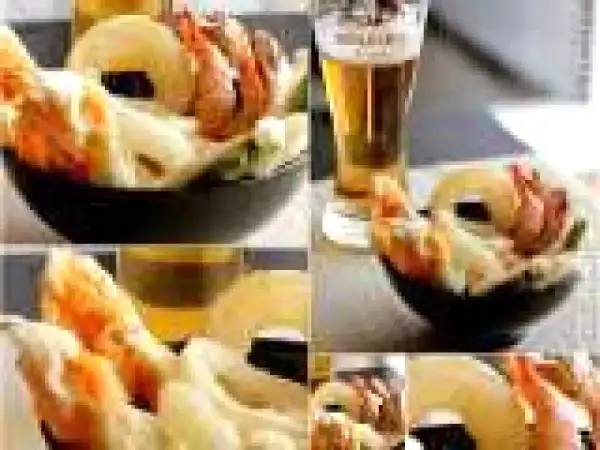 Gamberi e verdure croccanti, immersi in una leggera pastella per fritti, accompagnati da una birra bionda.